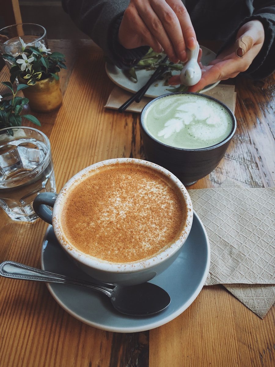 gray and white ceramic coffee cup with cappuccino